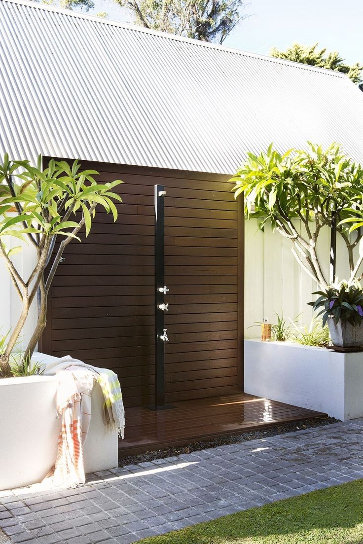 Frangipani trees frame our Aussie outdoor shower in the courtyard
