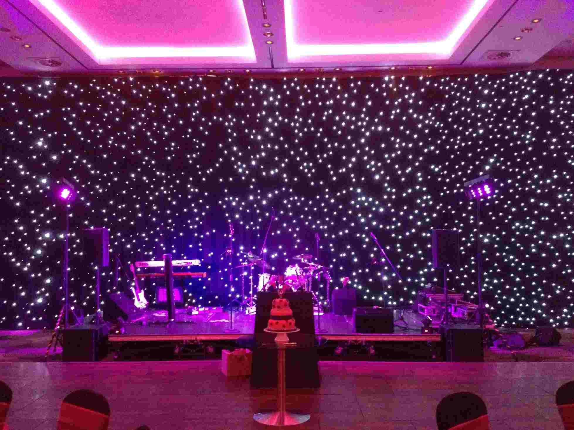 Led Stage Lighting Lovely which 14m Wide by 6m High Black Starcloth with Pink Led Bars